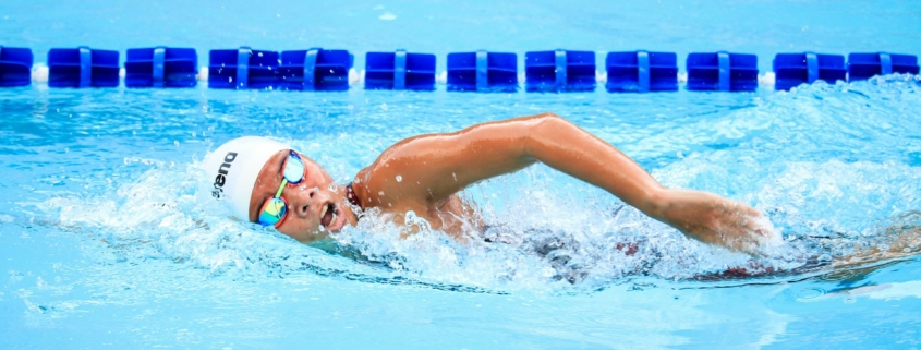 Person Swimming in Body of Water