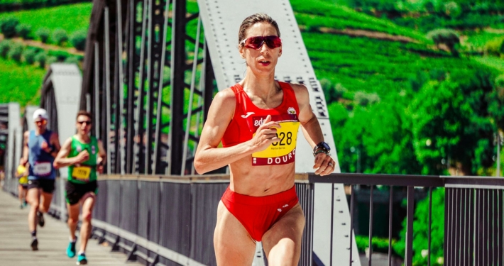 Woman Running on Bridge