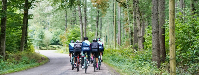 people riding bicycles on road during daytime